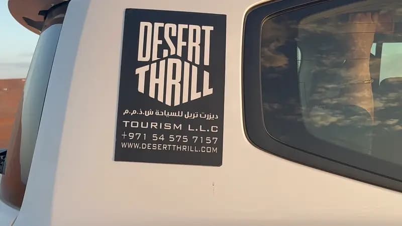Desert Thrill logo on the door of a safari Land Cruiser