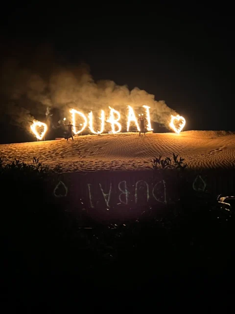 letters on fire that spell out dubai