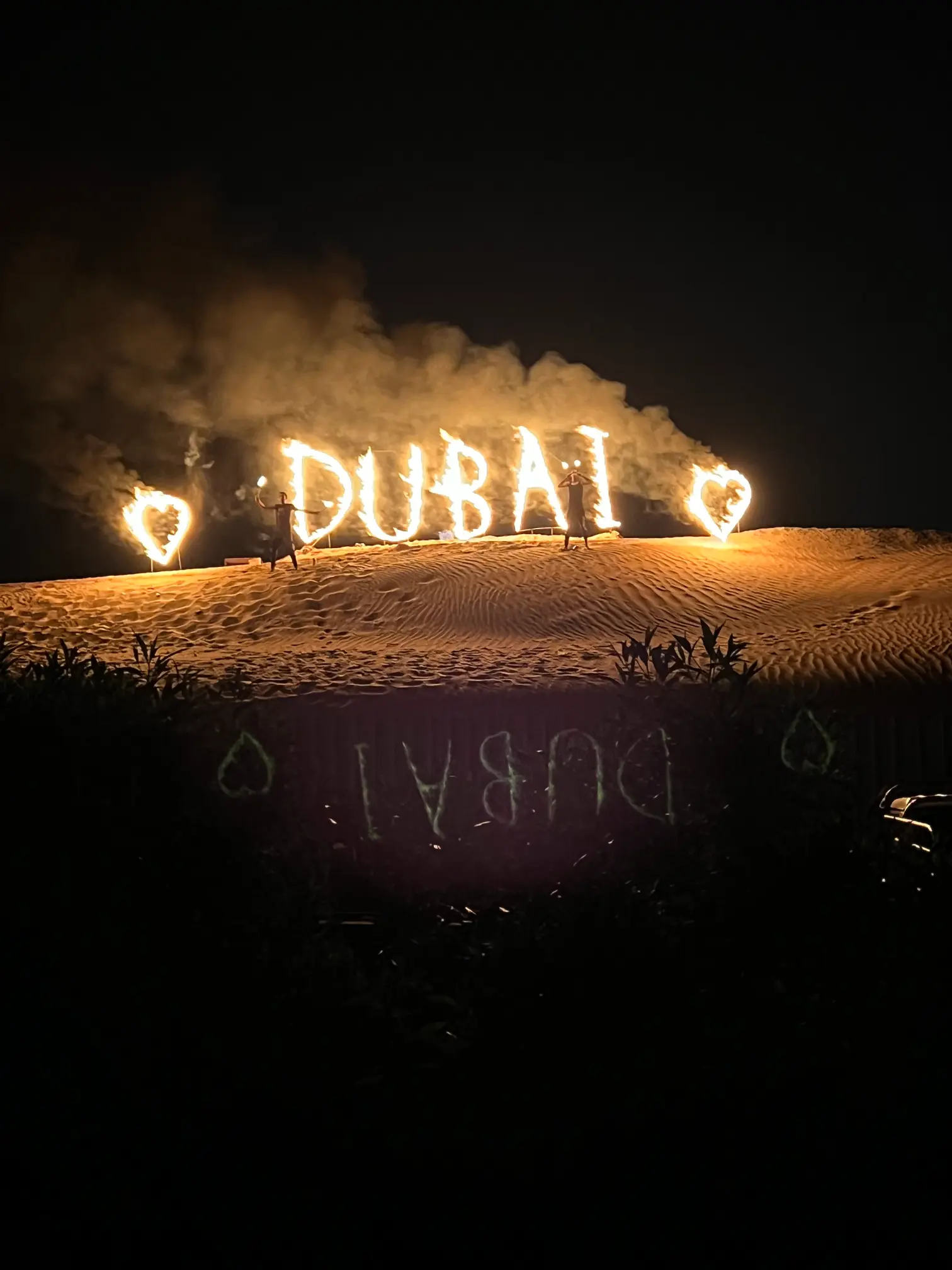 letters on fire that spell out dubai