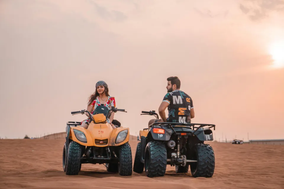 people riding desert quad and atv bike