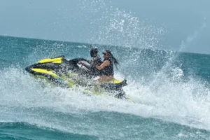 Guided jetski tour with guest drifting on water.