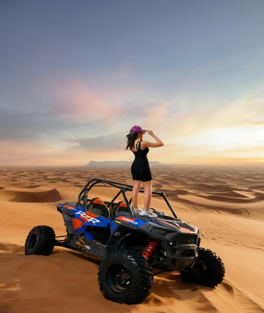girl taking a picture in middle of the desert on desert thrills two seater dune buggy adventure